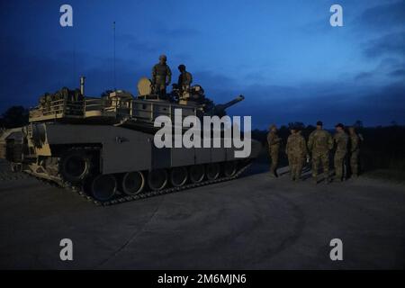 The M1A2 SEP V2 Main Battle Tank crew assigned to 2nd Battalion, 69th Armor Regiment, 2nd Armored Brigade Combat Team, 3rd Infantry Division, engages in boresight operation during preliminaries at Fort Benning, Georgia, May 2, 2022. The Sullivan Cup highlights and validates training education required to employ the latest advancements of Armor modernization in support of Armored Brigade Combat Teams and Cavalry formations. Stock Photo