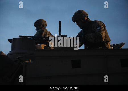 The M1A2 SEP V2 Main Battle Tank crew assigned to 2nd Battalion, 69th Armor Regiment, 2nd Armored Brigade Combat Team, 3rd Infantry Division, engages in boresight operation during preliminaries at Fort Benning, Georgia, May 2, 2022. The Sullivan Cup highlights and validates training education required to employ the latest advancements of Armor modernization in support of Armored Brigade Combat Teams and Cavalry formations. Stock Photo