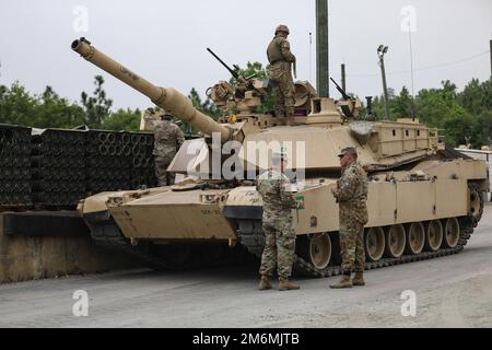 The M1A2 Abrams SEP V2 main battle tank crew assigned to 2nd Battalion, 69th Armored Regiment, 2nd Armored Brigade Combat Team, 3rd Infantry Division, reloads ammunition during preliminaries at Fort Benning, Georgia, May 2, 2022. The Sullivan Cup highlights and validates training education required to employ the latest advancements of Armor modernization in support of Armored Brigade Combat Teams and Cavalry formations. Stock Photo