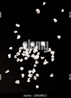 Salt on black Stock Photo