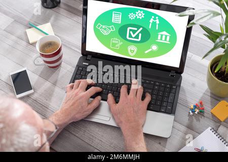 Validation concept shown on a laptop used by a man Stock Photo
