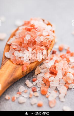 Pink himalayan salt in the wooden spoon. Stock Photo