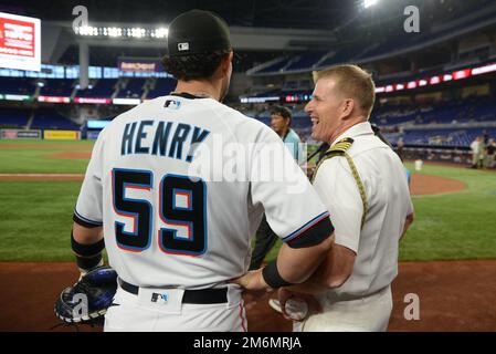 Miami Marlins catcher Payton Henry makes the throw to second base