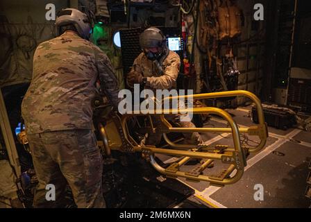 Aerial gunners with the 73rd Special Operations Squadron prepare to ...
