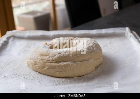 Raw ciabatta bread on a baking tray. Ready to bake Stock Photo