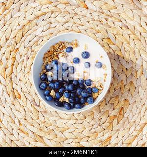 Blueberry yogurt cereal bowl as healthy breakfast and morning meal, sweet food and organic berry fruit, diet and nutrition Stock Photo