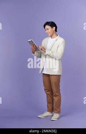 portrait of a young man using tablet computer Stock Photo