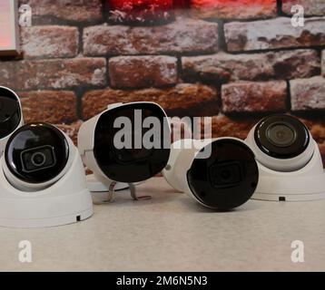 Metal outdoor CCTV cameras for video surveillance systems on a shelf at security store Stock Photo