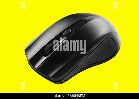 Gray modern computer wireless mouse. Isolated on yellow background. Stock Photo