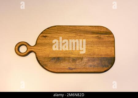 Wooden cutting board on the white background Stock Photo