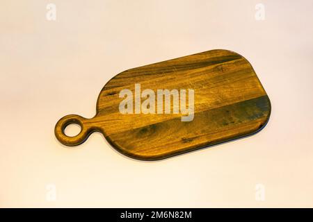 Wooden cutting board on the white background Stock Photo