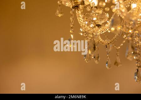 The crystal chandelier lighting up the room Stock Photo