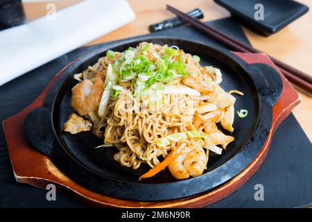 Yakisoba, literally 'fried noodles', integrated into Japanese cuisine, just like ramen. Stock Photo