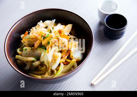 Yakisoba, literally 'fried noodles', integrated into Japanese cuisine, just like ramen. Stock Photo