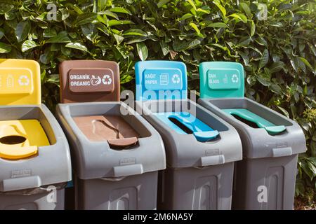 Colored Rubbish Containers for Separate Sorting of Garbage. Bins for Recycling Different Types of Waste Plastic, Glass, Paper, T Stock Photo