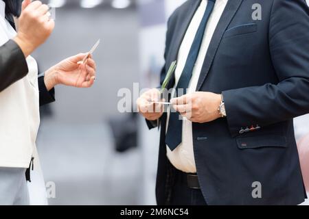 Business people exchanging business card on business meeting, Business discussion talking deal concept. Stock Photo