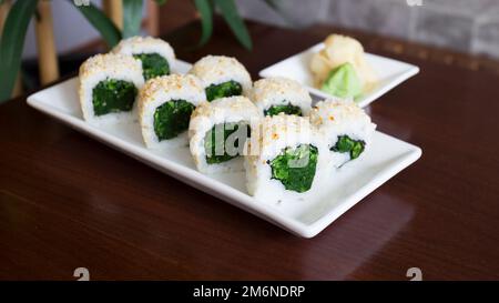 Vegan Uramaki Sushi with vegetables . Vegetarian Japanese Food. Stock Photo