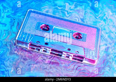 Retro audio compact cassette tape for recorder or player in bright acid neon colors. Vintage Style 80-90s. Template for music al Stock Photo
