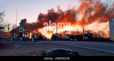 Smoke from fire on outskirts of city after air strike by Russian aircraft on city of Chernihiv. Stock Photo