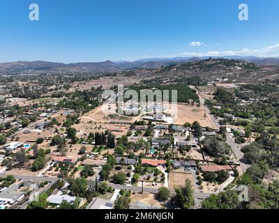 Aerial view of dry valley with houses and barn in Escondido, California Stock Photo