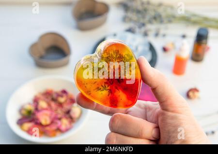 Making soap from pour and melt soap base concept. Soap making ingredients  on brown wooden background. melt and pour method, buy a soap base Stock  Photo - Alamy