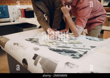 Architect with blueprints and layout design project at office Stock Photo