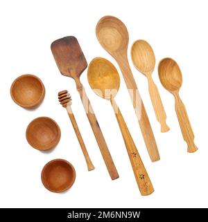 Empty wooden spoons and wooden bowls on a white isolated background Stock Photo