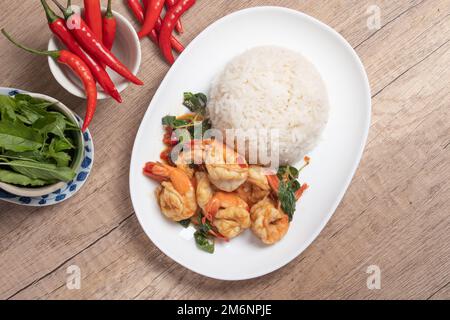 Shrimp basil with steamed rice.Thai spicy food.Street food Stock Photo