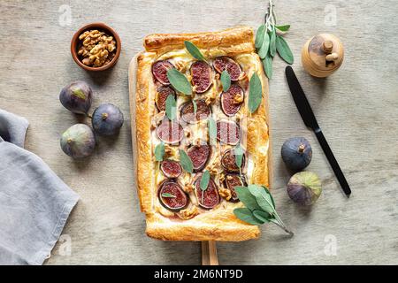 Cheese and fig tart with sage, honey, and walnuts. Stock Photo