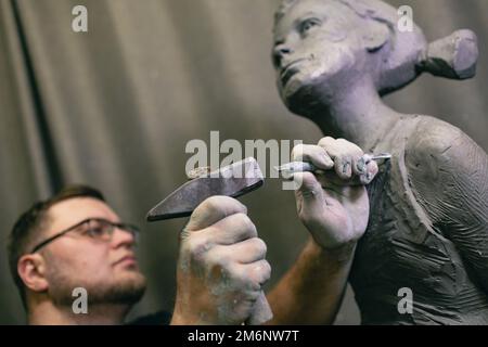 A Man and a Woman Sculpting Clay Statue · Free Stock Photo