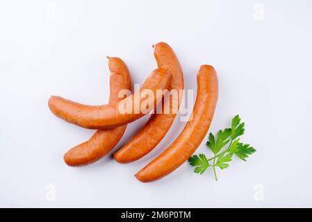 Traditional raw German bockwurst offered as top view on white background with copy space Stock Photo