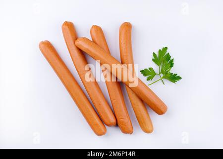 Traditional raw German bockwurst offered as top view on white background with copy space Stock Photo