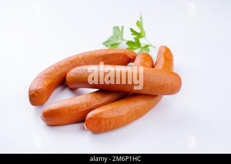 Traditional raw German bockwurst offered as top view on white background with copy space Stock Photo
