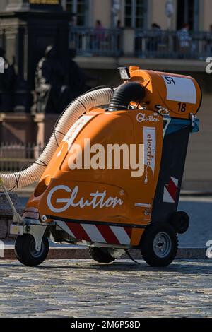 https://l450v.alamy.com/450v/2m6p58d/cleaning-worker-cleaning-the-sidewalks-of-the-city-park-with-a-glutton-which-is-an-electric-vacuum-cleaner-for-urban-and-industrial-waste-2m6p58d.jpg