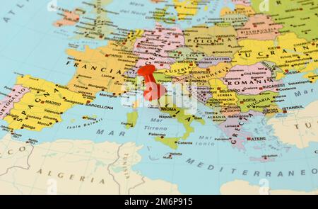 Red push pin pointing at Rome, Italy, on a map of europe Stock Photo