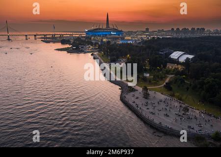 Russia, St. Petersburg, 17 August 2022: A picturesque sunset over the sights, the Gazprom Arena football stadium, the highest sk Stock Photo