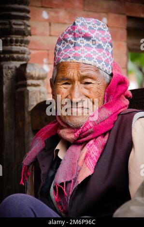 Faces of Nepal - Mature Men wearing Nepali topi Stock Photo - Alamy