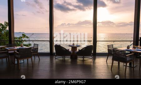 Restaurant at oceanfront during sunset in Pattaya Thailand Stock Photo