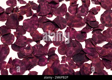 Dried purple sweet potatoes on the white background Stock Photo