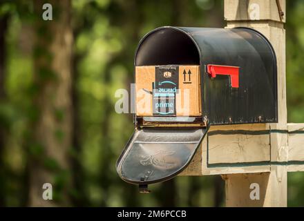 Amazon prime box delivered to residential mailbox. Amazon offers free package delivery to it's prime members. Stock Photo