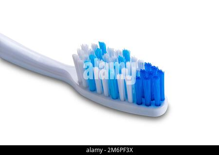 Closeup of blue soft tooth brush isolated on white background. Stock Photo