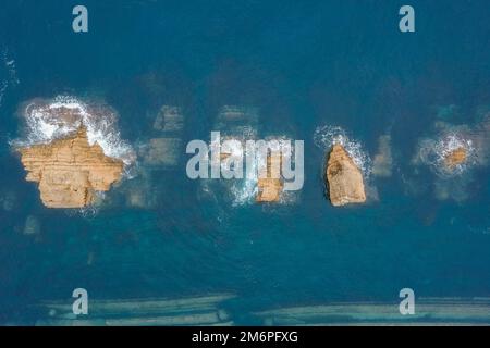 Aerial view of cliffs and rocks on the sea Stock Photo