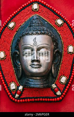 Mask of the Buddha, Buddha Handicraft kept for sale in the street of Nepal. Stock Photo