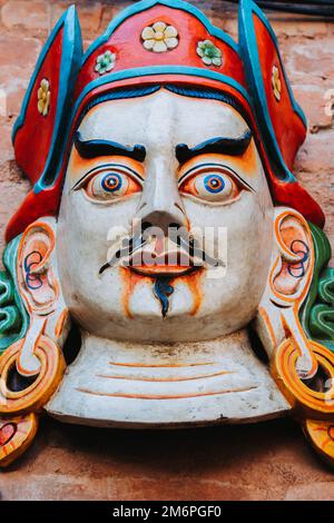 Colorful wooden mask or handicraft kept for sale at the shop in Swayambhunath, Kathmandu Nepal. Stock Photo
