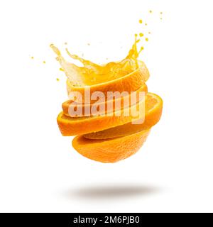 Cut orange slices with splash juice, isolated on white. Stock Photo