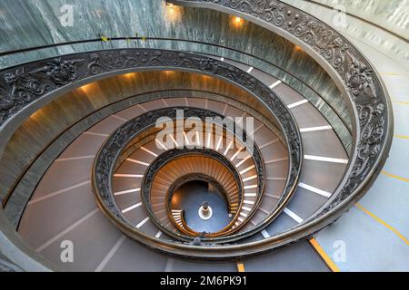 The Bramante Staircase is a double helix, having two staircases allowing people to ascend without meeting people descending Stock Photo