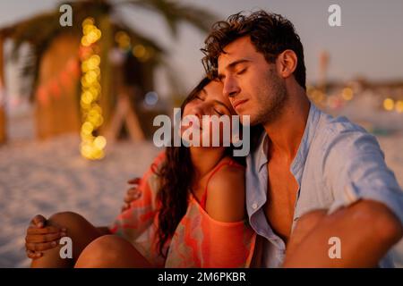Multi-ethnic group of male and female dancing with firework stick Stock Photo