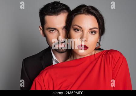 Portrait of elegant couple looking at camera isolated on grey,stock image Stock Photo