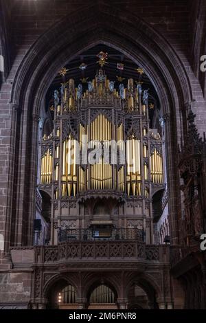Close-up view of the church organ and pipes in the central nave of the historic Chester Cathedral in Cheshire Stock Photo