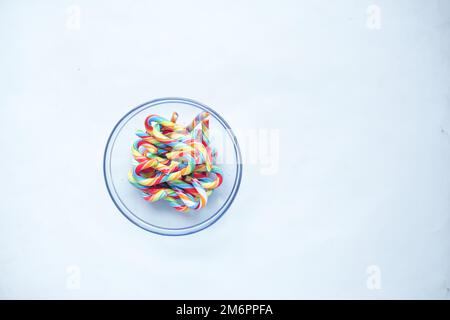 mini cherry candy canes on white background  Stock Photo